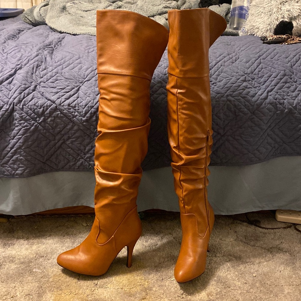 Thigh high heeled boots